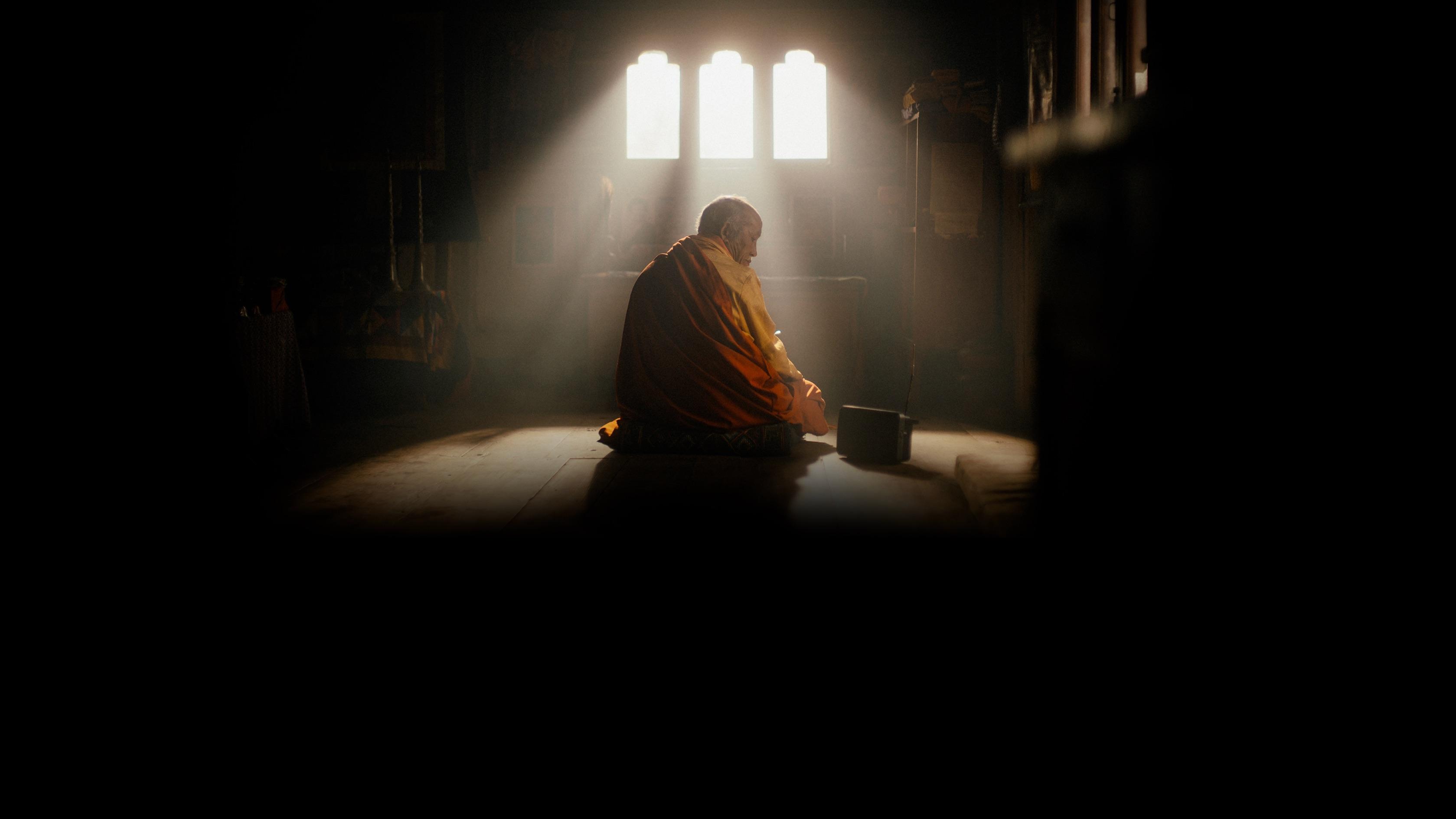 The Monk and the Gun Background