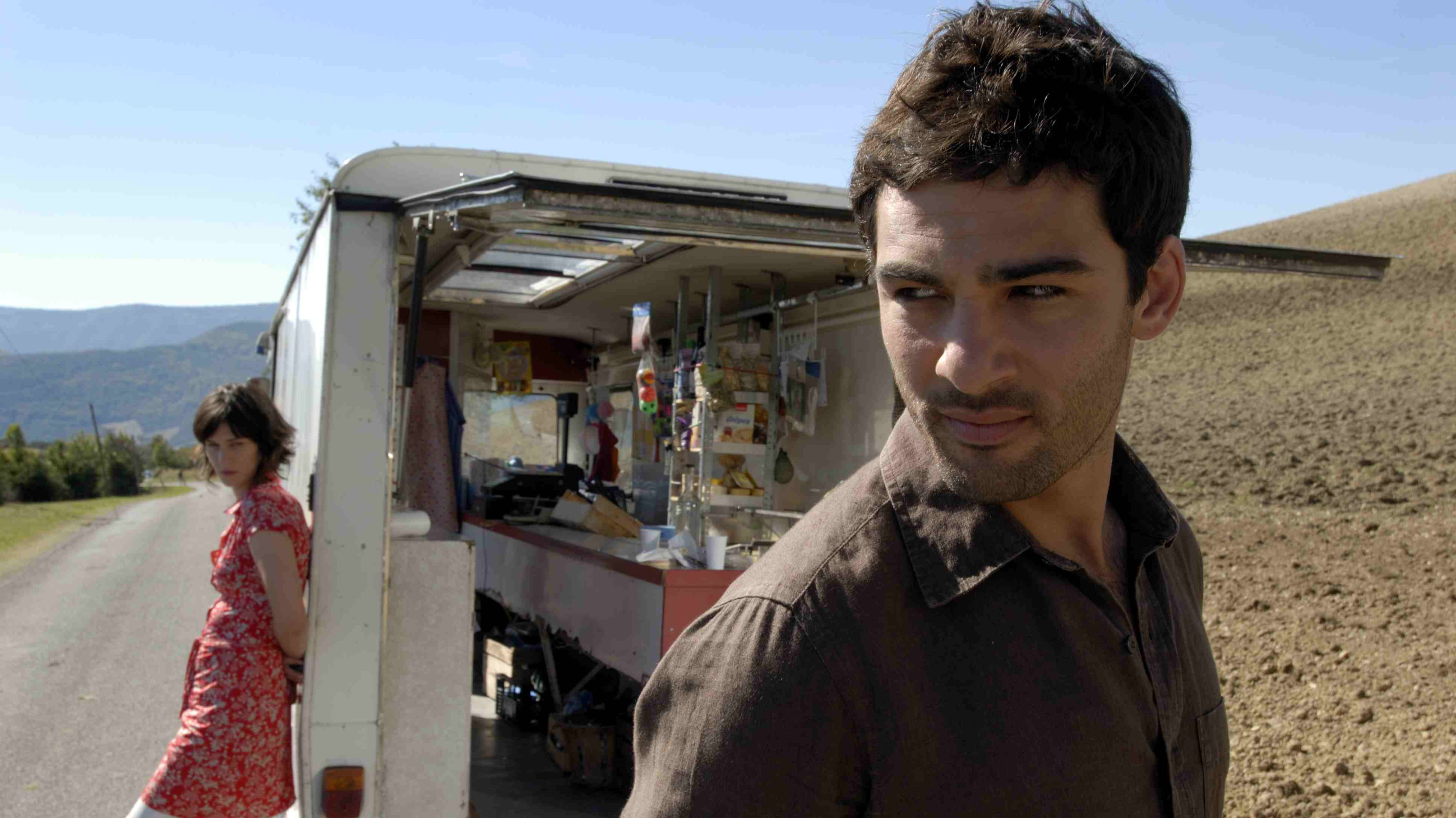 The Grocer's Son Background